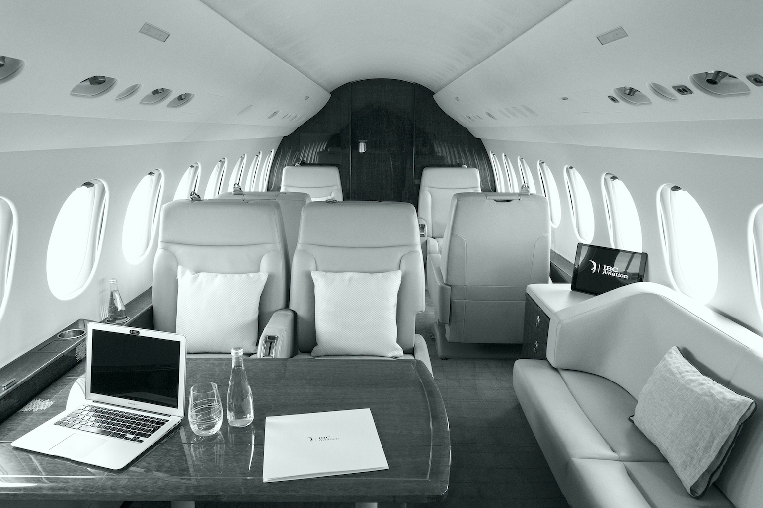 Private jet cabin arranged for working on board.