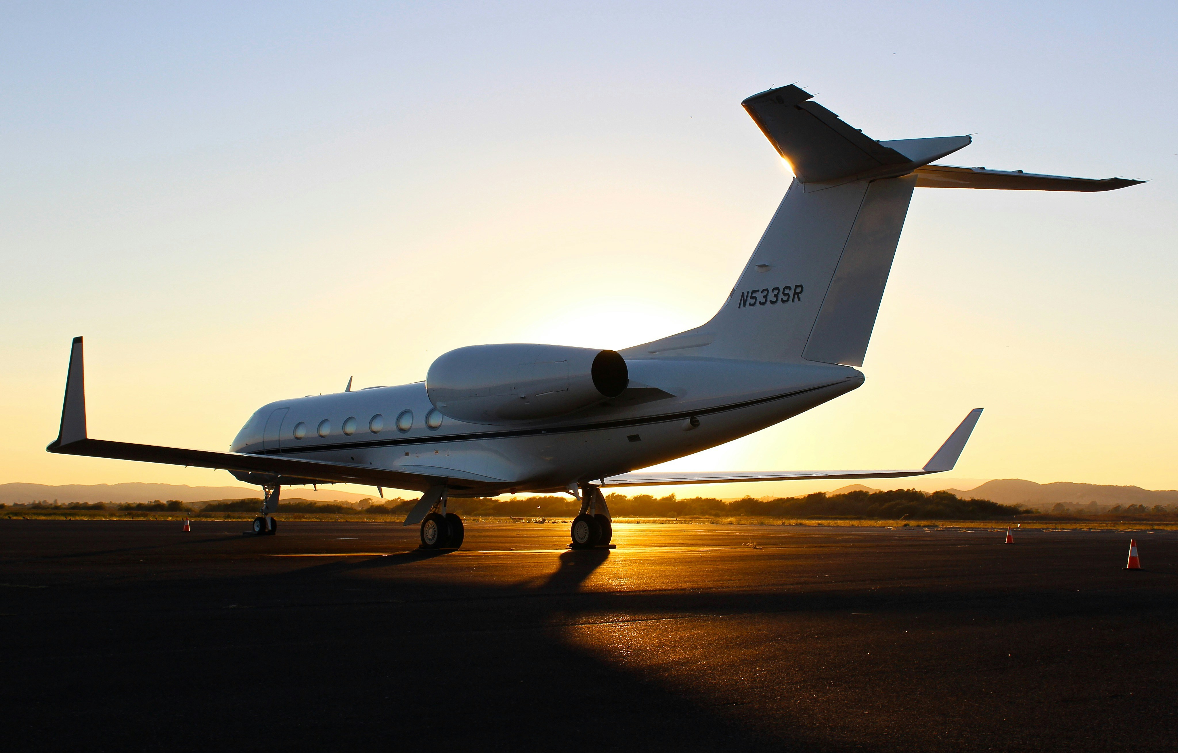 Gulfstream G800 in flight over coastal landscape — ultra-long-range private jet with 8,200 nm range