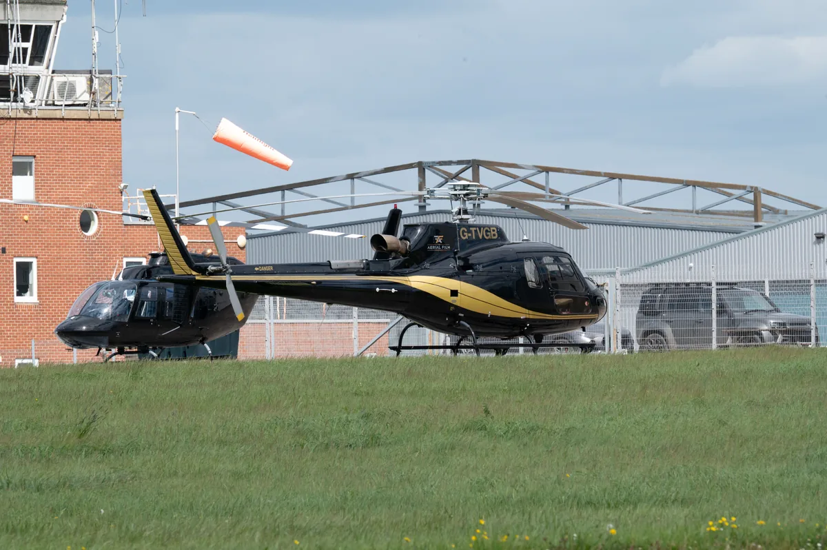 Helicopter parked at an airfield